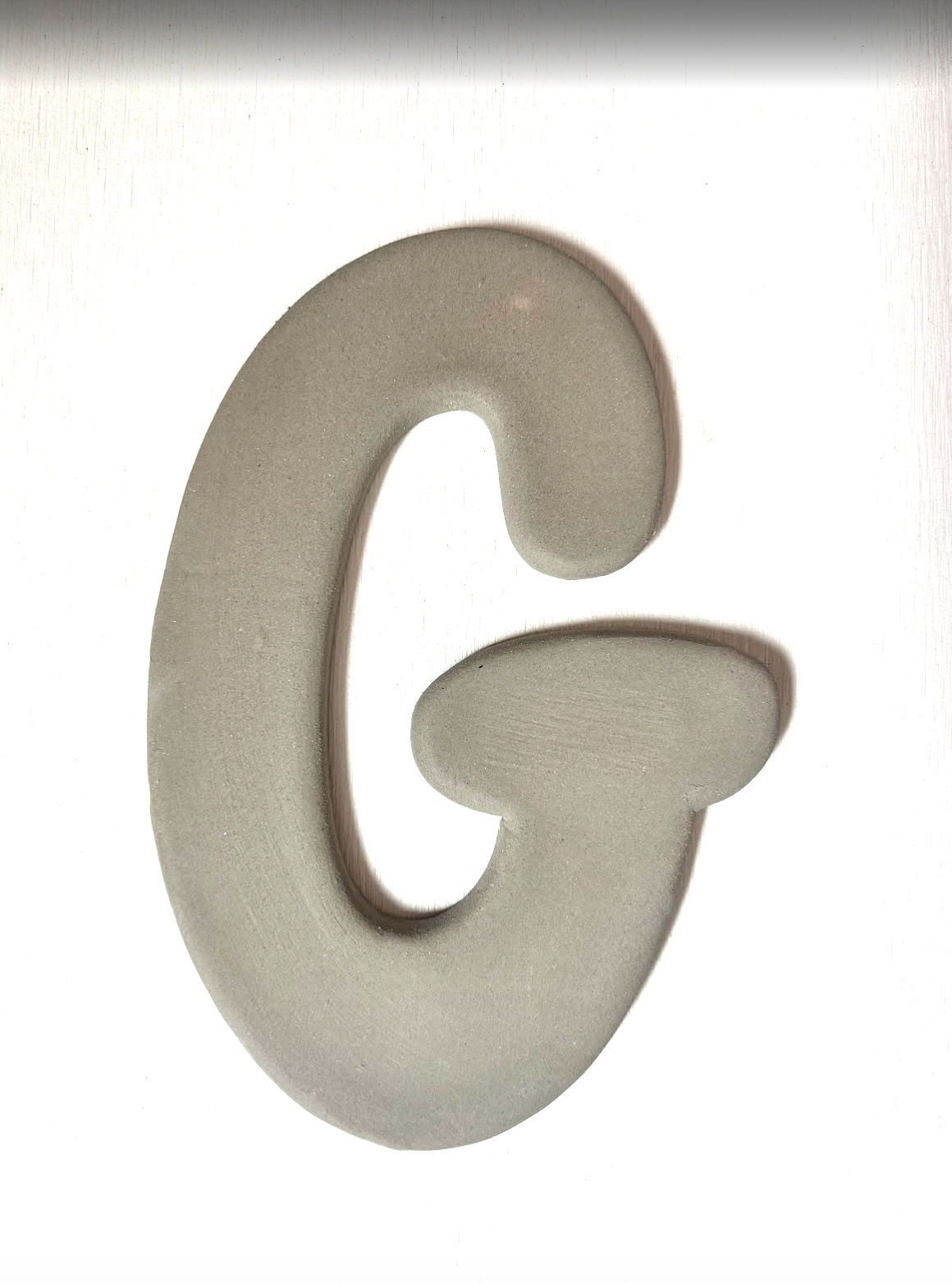 Keramische letter G