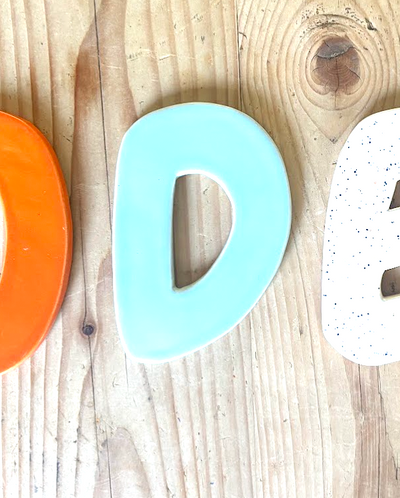 Keramische letter D